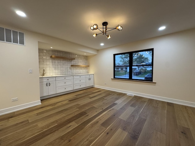 6013 Perry Dr, Woodridge, IL 60517 - unfurnished dining area with wood finished floors, a chandelier, baseboards, and recessed lighting