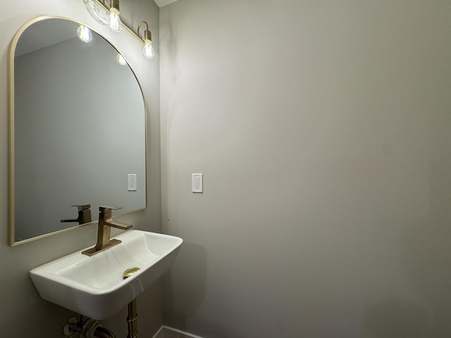 6013 Perry Dr, Woodridge, IL 60517 - bathroom featuring a sink and baseboards