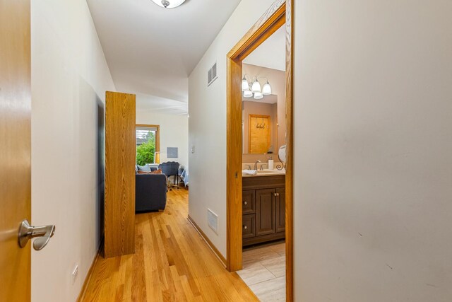165 Lance Dr, Des Plaines, IL 60016 - corridor featuring light wood-style flooring