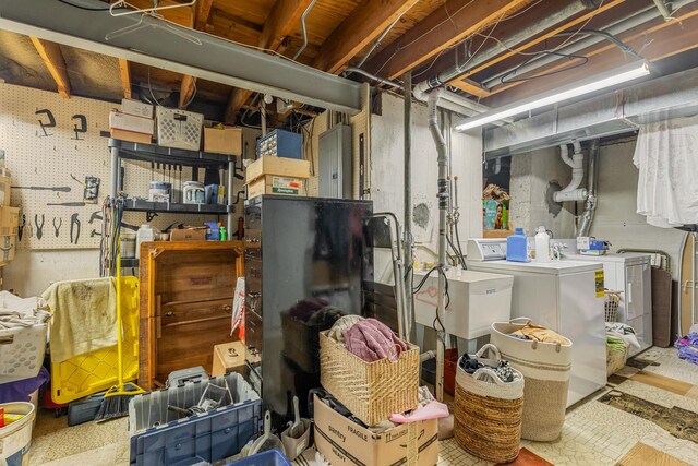 165 Lance Dr, Des Plaines, IL 60016 - unfinished below grade area featuring washer and clothes dryer, electric panel, and a sink