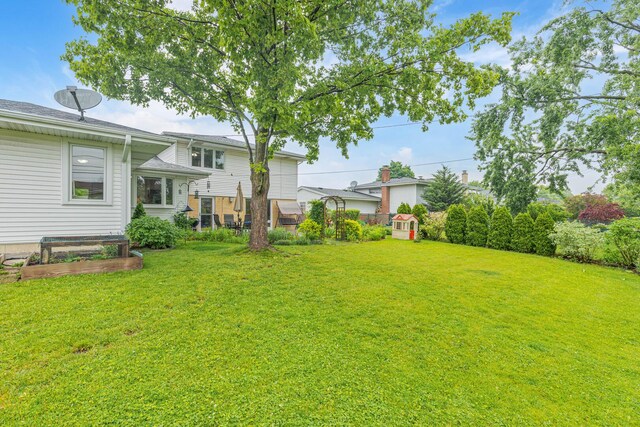 165 Lance Dr, Des Plaines, IL 60016 - view of grassy yard with a vegetable garden