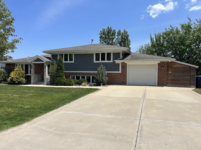 8519 S 82nd Ct, Hickory Hills, IL 60457 - split level home featuring an attached garage, driveway, a front lawn, and brick siding