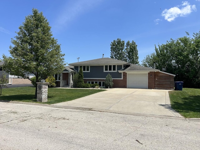 8519 S 82nd Ct, Hickory Hills, IL 60457 - split level home with an attached garage, a front yard, concrete driveway, and brick siding
