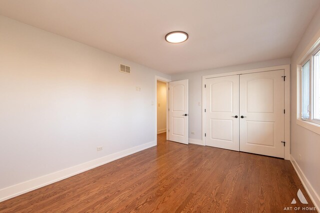 8519 S 82nd Ct, Hickory Hills, IL 60457 - unfurnished bedroom with wood finished floors, baseboards, and a closet