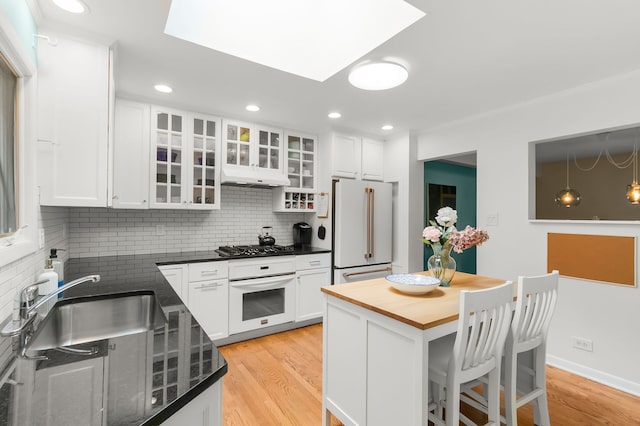 464 Northgate Ct, Riverside, IL 60546 - kitchen with white appliances, backsplash, light wood-type flooring, white cabinetry, and recessed lighting