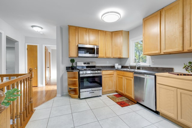 124 N W End Ave, Westmont, IL 60559 - kitchen featuring stainless steel appliances, light brown cabinets, and dark countertops