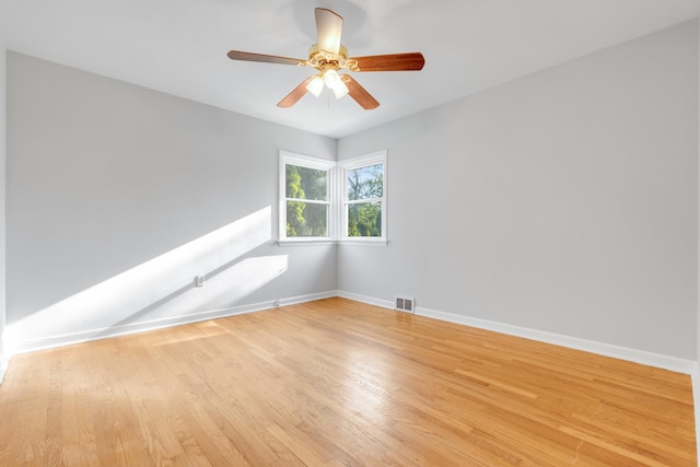 124 N W End Ave, Westmont, IL 60559 - unfurnished room with baseboards, light wood finished floors, and a ceiling fan