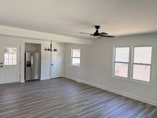 528 Ivy Ct, Round Lake Beach, IL 60073 - unfurnished living room with dark wood-style floors, ceiling fan, plenty of natural light, and baseboards