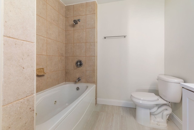 718 Sycamore St, Ottawa, IL 61350 - bathroom with baseboards, toilet, bathtub / shower combination, and vanity