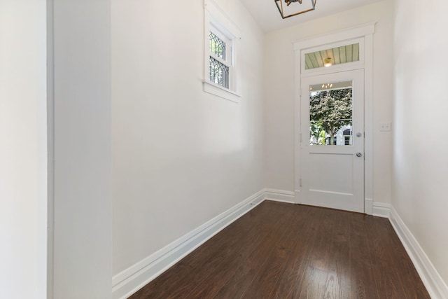 718 Sycamore St, Ottawa, IL 61350 - doorway with dark wood finished floors, baseboards, and a chandelier