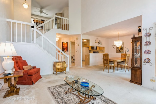 241 Old Oak Ct W, Buffalo Grove, IL 60089 - living room with carpet, stairway, ceiling fan, a chandelier, and a high ceiling