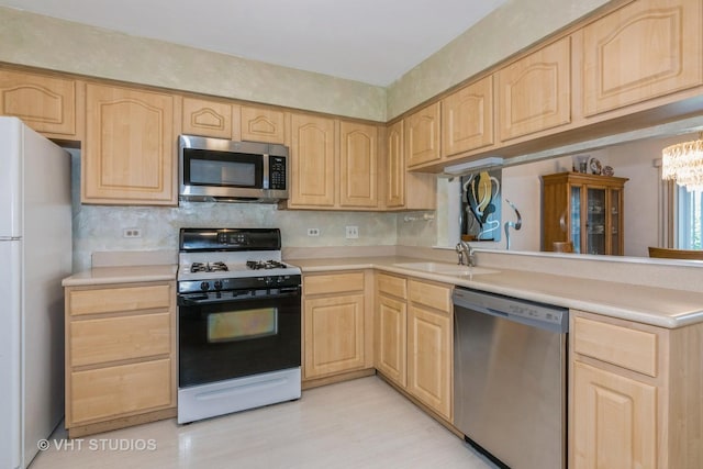 241 Old Oak Ct W, Buffalo Grove, IL 60089 - kitchen with appliances with stainless steel finishes, light brown cabinets, a sink, light countertops, and a chandelier