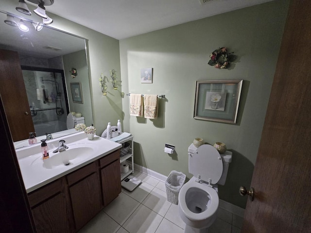9906 Shady Ln Unit 1Sw, Orland Park, IL 60462 - bathroom with tile patterned flooring, toilet, vanity, and baseboards