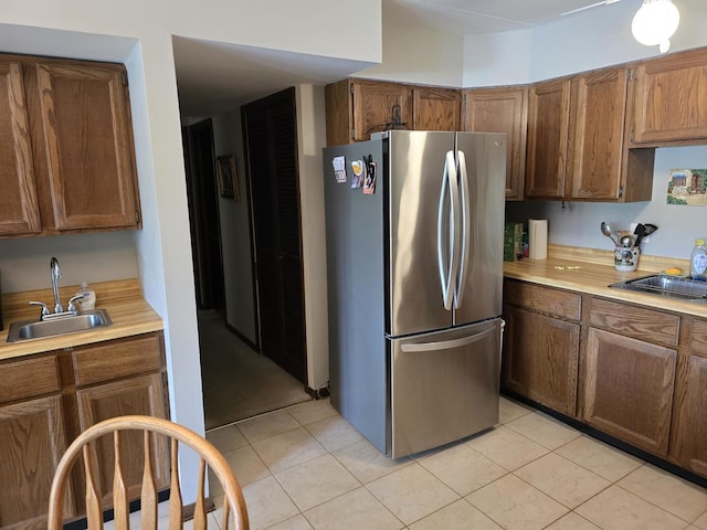 9906 Shady Ln Unit 1Sw, Orland Park, IL 60462 - kitchen with freestanding refrigerator, a sink, light countertops, and light tile patterned floors