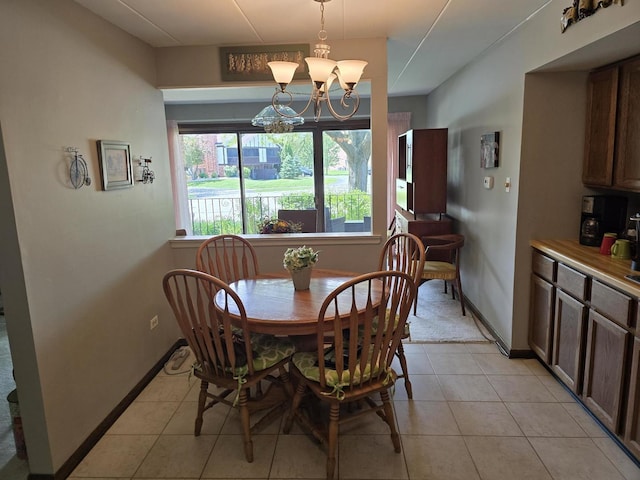 9906 Shady Ln Unit 1Sw, Orland Park, IL 60462 - dining space featuring light tile patterned floors, a chandelier, and baseboards