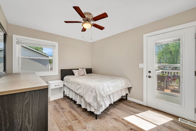 710 Sunset Ln, Shorewood, IL 60404 - bedroom featuring light wood finished floors, multiple windows, and ceiling fan