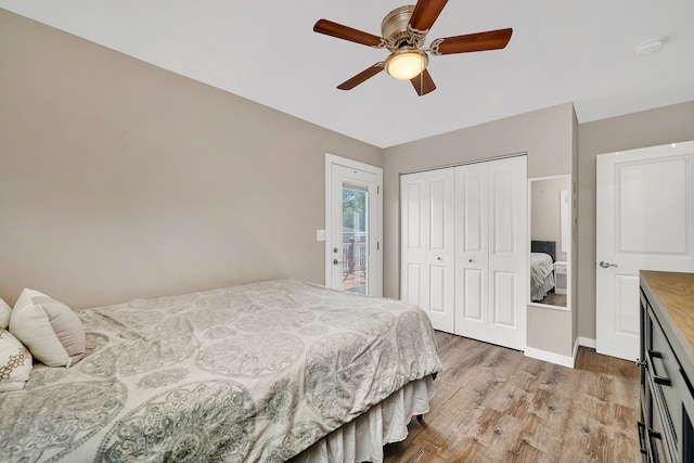 710 Sunset Ln, Shorewood, IL 60404 - bedroom with light wood finished floors, a closet, and ceiling fan