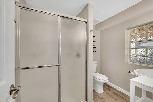 710 Sunset Ln, Shorewood, IL 60404 - bathroom with wood finished floors and a stall shower