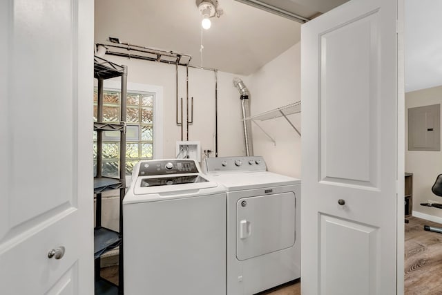 710 Sunset Ln, Shorewood, IL 60404 - laundry area with washer and dryer, electric panel, and light wood-style floors