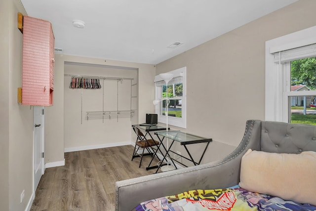 710 Sunset Ln, Shorewood, IL 60404 - bedroom featuring wood finished floors and baseboards