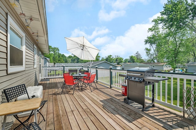 710 Sunset Ln, Shorewood, IL 60404 - wooden terrace with outdoor dining space, a lawn, and grilling area