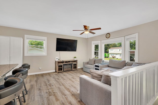 710 Sunset Ln, Shorewood, IL 60404 - living area featuring light wood finished floors and ceiling fan
