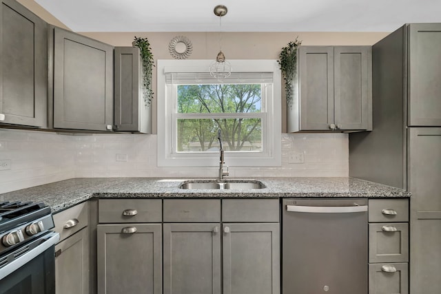 710 Sunset Ln, Shorewood, IL 60404 - kitchen with appliances with stainless steel finishes, gray cabinetry, backsplash, and light stone countertops