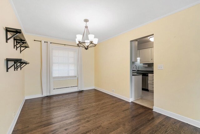 1412 Hinman Ave Unit 2W, Evanston, IL 60201 - spare room with dark wood-type flooring, a chandelier, and ornamental molding