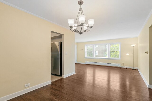 1412 Hinman Ave Unit 2W, Evanston, IL 60201 - spare room with baseboard heating, wood finished floors, a chandelier, and crown molding