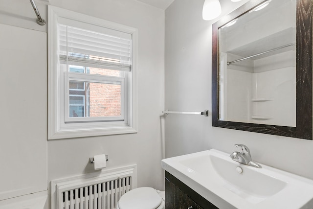 1412 Hinman Ave Unit 2W, Evanston, IL 60201 - bathroom with radiator, vanity, and a shower