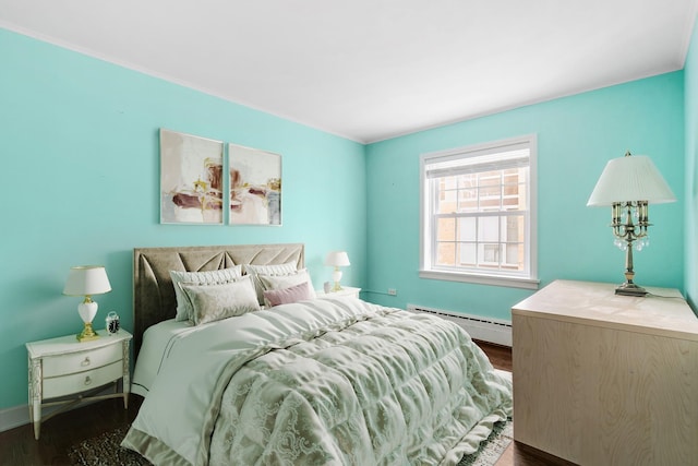 1412 Hinman Ave Unit 2W, Evanston, IL 60201 - bedroom with baseboard heating and dark wood-style flooring