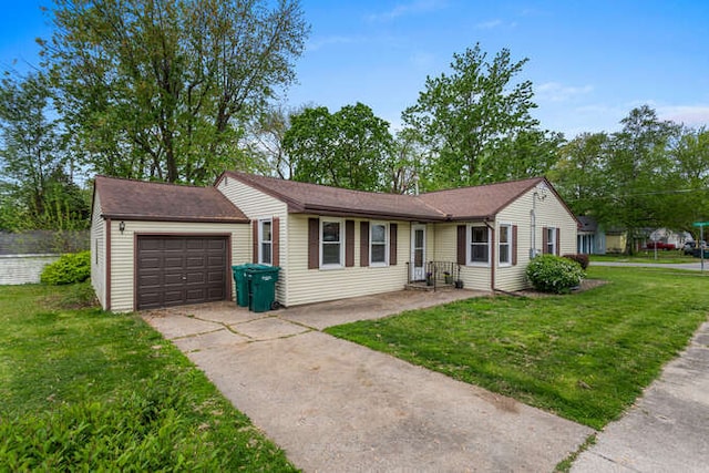 307 N Carico St, Tuscola, IL 61953 - single story home with driveway, a front yard, and an attached garage