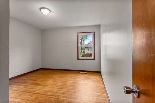 307 N Carico St, Tuscola, IL 61953 - unfurnished room with light wood-style flooring and baseboards