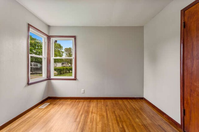 307 N Carico St, Tuscola, IL 61953 - spare room with light wood-style flooring and baseboards