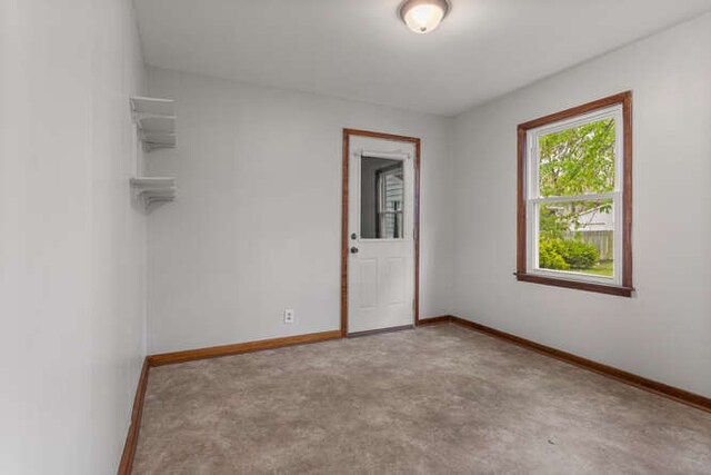 307 N Carico St, Tuscola, IL 61953 - empty room featuring baseboards