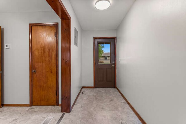 307 N Carico St, Tuscola, IL 61953 - doorway featuring baseboards and electric panel