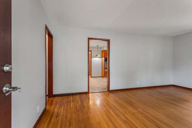 307 N Carico St, Tuscola, IL 61953 - spare room featuring wood finished floors and baseboards