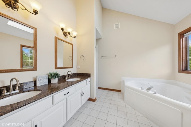 2631 Saltmeadow Rd, Naperville, IL 60564 - bathroom featuring double vanity, a garden tub, tile patterned floors, baseboards, and high vaulted ceiling