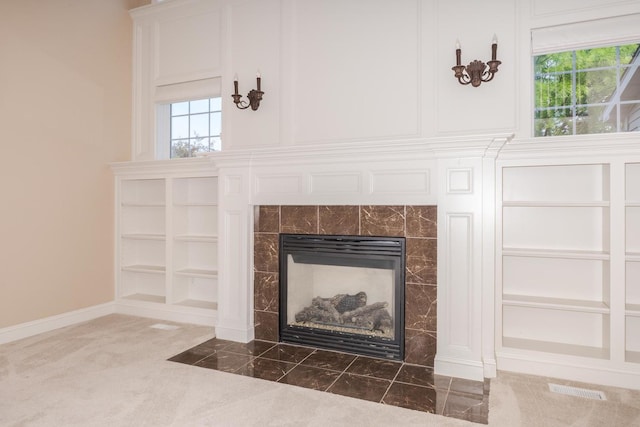 2004 Withers Ln, Bloomington, IL 61704 - detailed view of a tile fireplace and carpet flooring