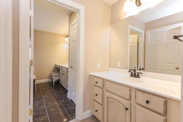 2004 Withers Ln, Bloomington, IL 61704 - bathroom with vanity and marble look tile flooring