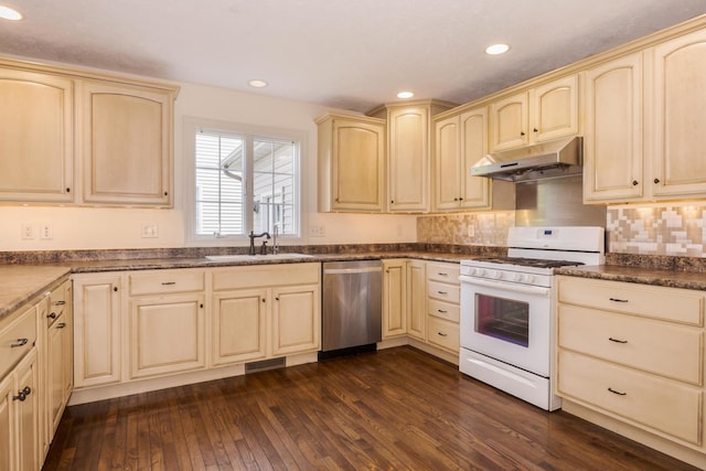 2004 Withers Ln, Bloomington, IL 61704 - kitchen featuring stainless steel dishwasher, gas range gas stove, under cabinet range hood, dark wood finished floors, and recessed lighting