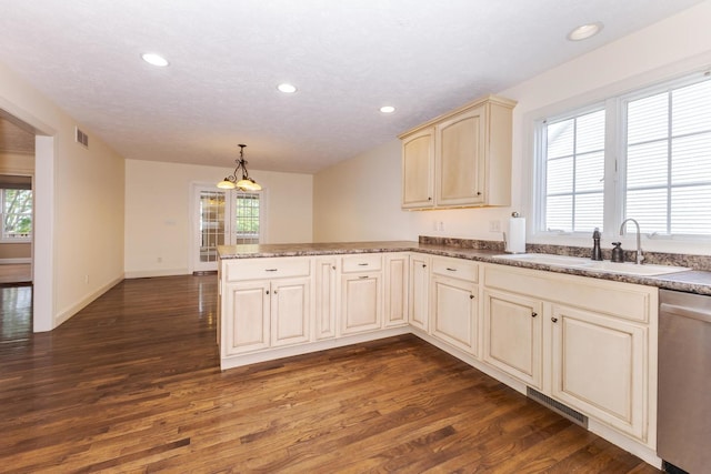 2004 Withers Ln, Bloomington, IL 61704 - kitchen with cream cabinets, dishwasher, a peninsula, dark wood-style floors, and recessed lighting