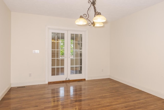 2004 Withers Ln, Bloomington, IL 61704 - unfurnished room featuring french doors and wood finished floors