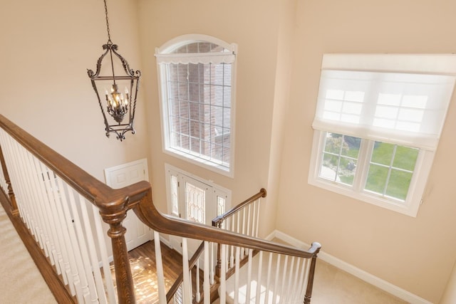 2004 Withers Ln, Bloomington, IL 61704 - stairway with a chandelier and carpet