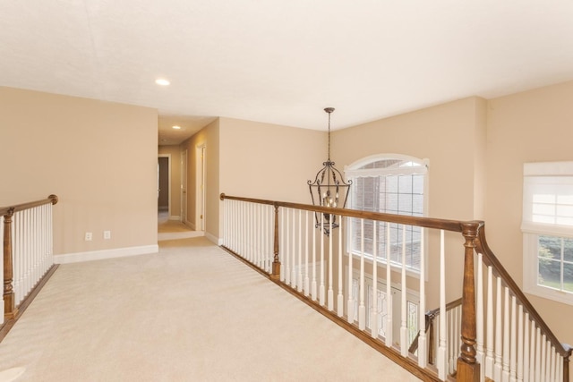 2004 Withers Ln, Bloomington, IL 61704 - hallway with an upstairs landing, a chandelier, carpet flooring, and recessed lighting