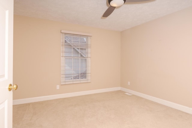 2004 Withers Ln, Bloomington, IL 61704 - empty room with ceiling fan, light colored carpet, and a textured ceiling