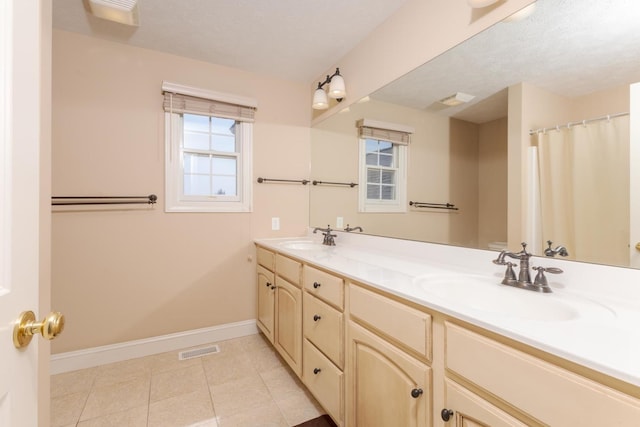 2004 Withers Ln, Bloomington, IL 61704 - full bath featuring double vanity and tile patterned floors