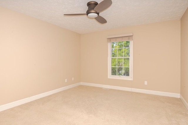 2004 Withers Ln, Bloomington, IL 61704 - empty room with a textured ceiling, ceiling fan, and light colored carpet