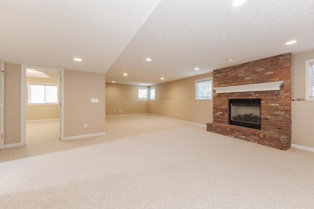 2004 Withers Ln, Bloomington, IL 61704 - below grade area featuring recessed lighting, a brick fireplace, and carpet