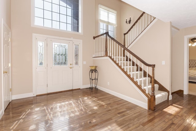 2004 Withers Ln, Bloomington, IL 61704 - entryway featuring hardwood / wood-style flooring, stairs, and a towering ceiling